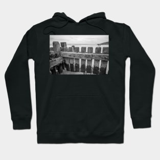 Close up of wooden sea defences protecting against coastal erosion Hoodie
